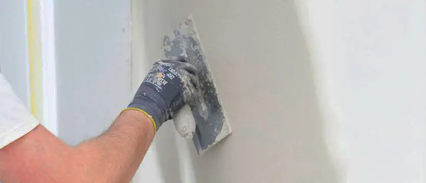 professional drywall patching with a trowel