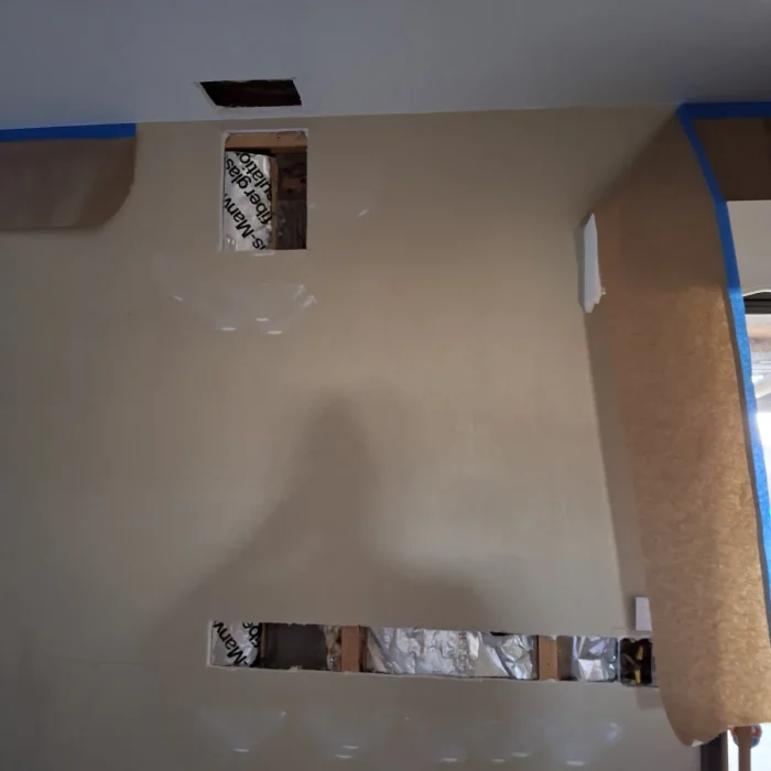Access slot cut in wall