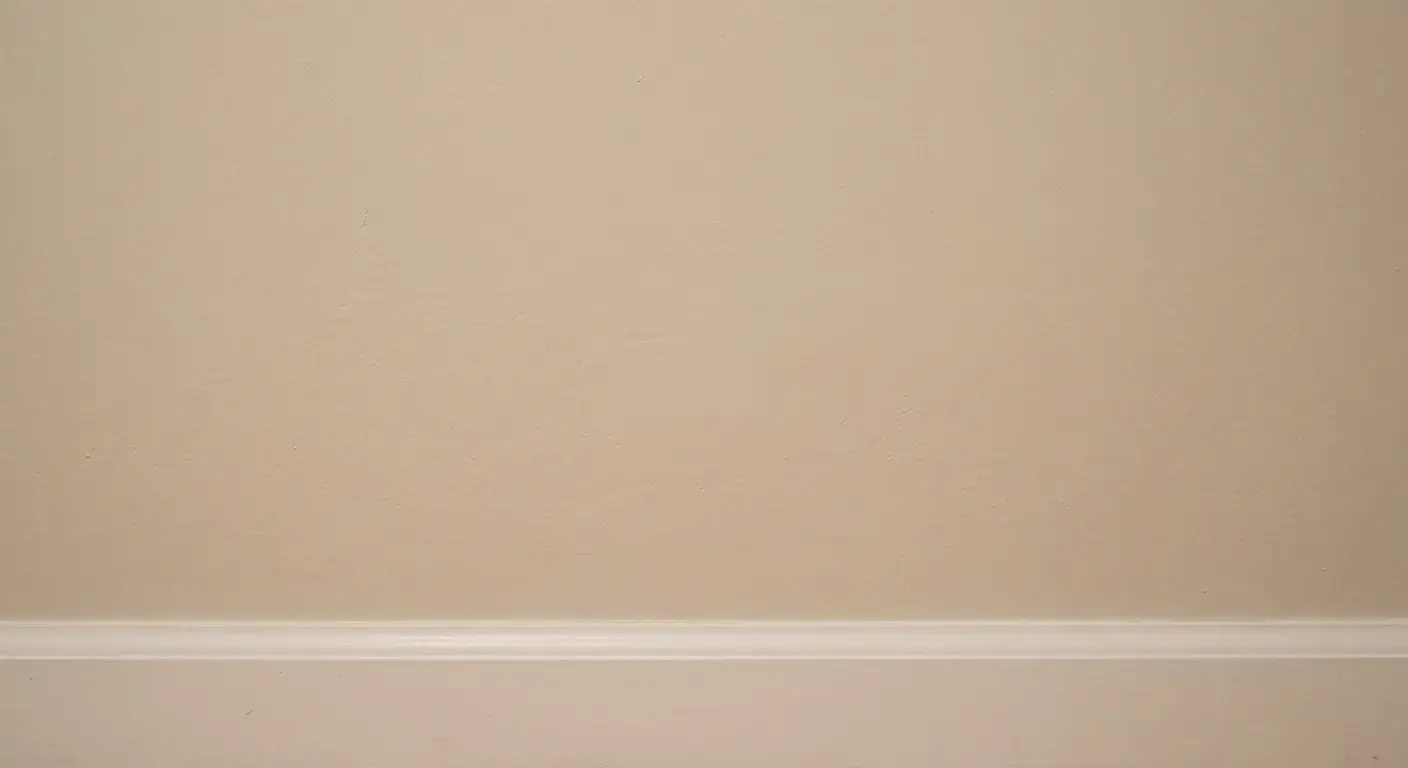 Finished drywall patch blended into a painted wall with matching texture
