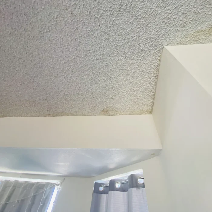 Popcorn ceiling stain above soffit