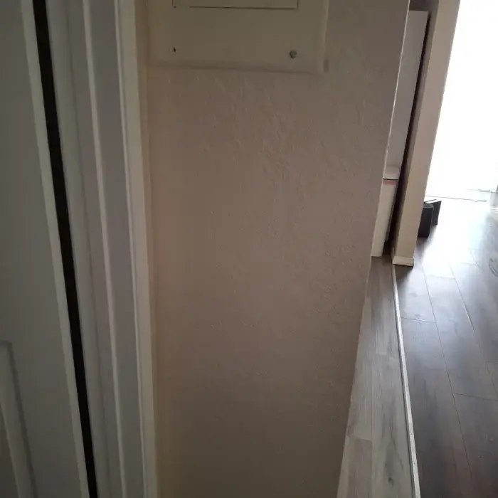 Repaired hallway wall
