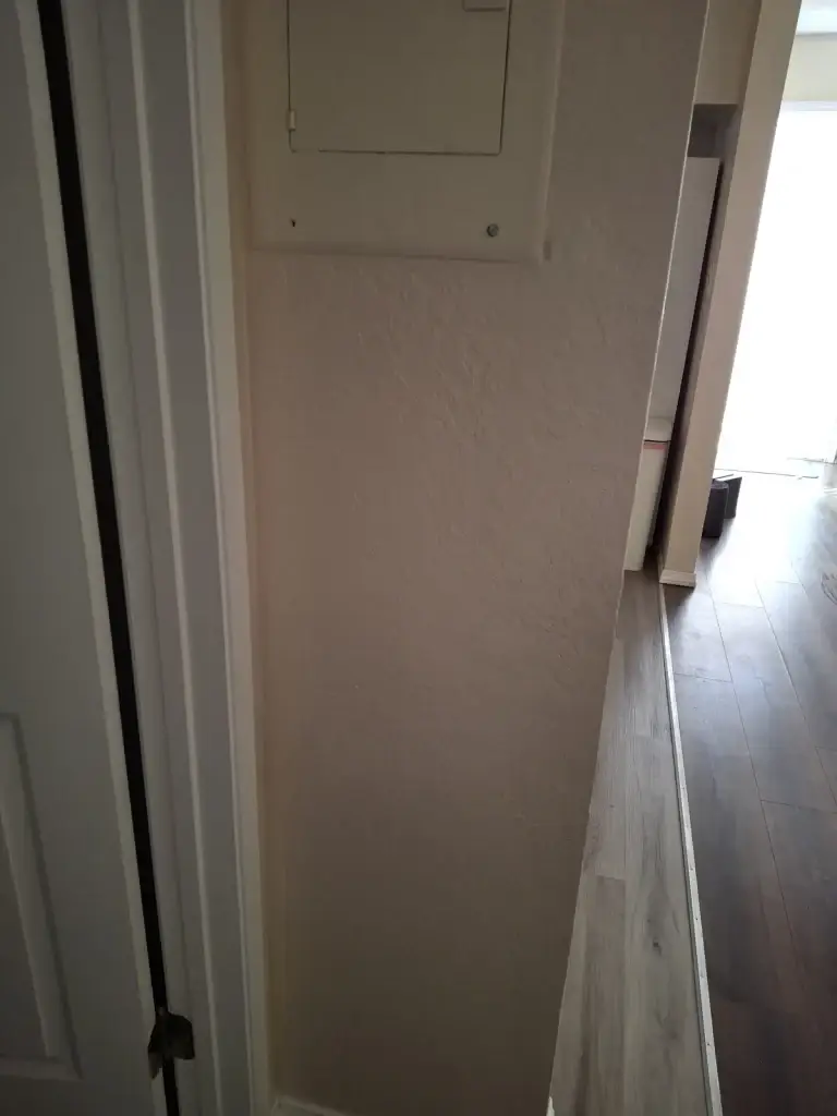 Repaired hallway wall