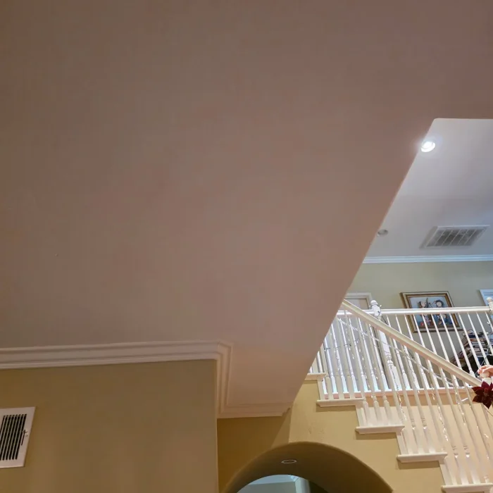 Repaired high wall over staircase