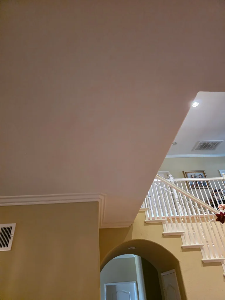Repaired high wall over staircase