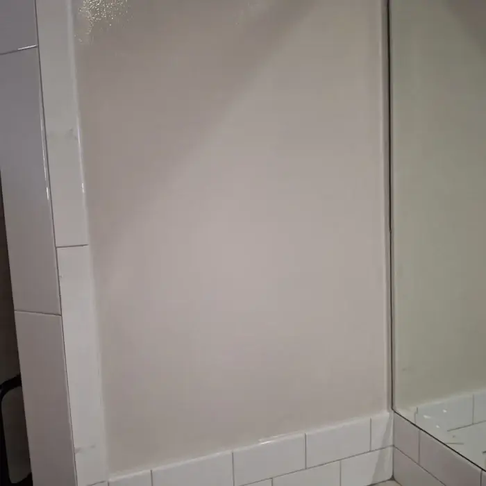 Repaired shower wall panel