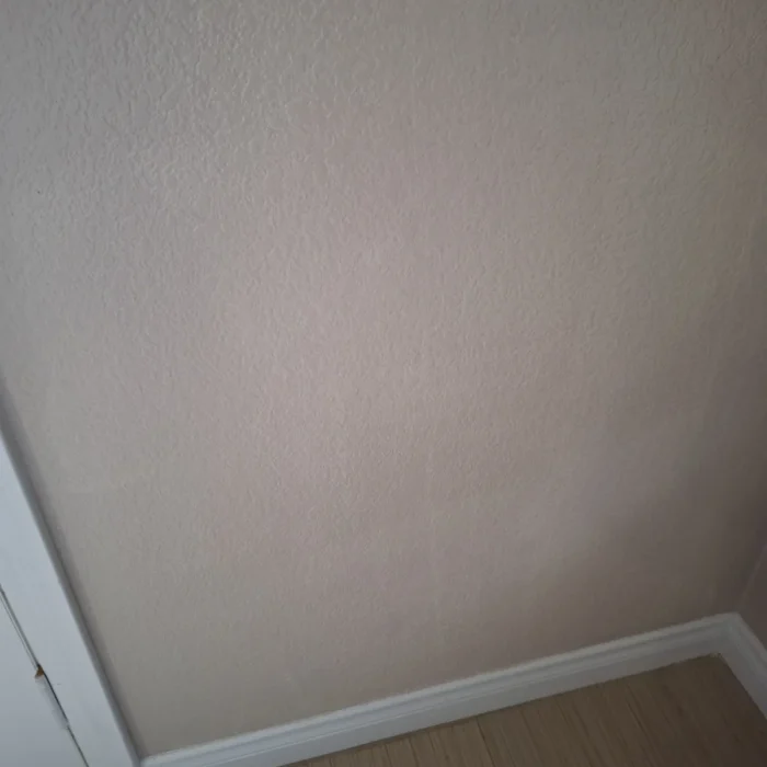 Repaired wall by door