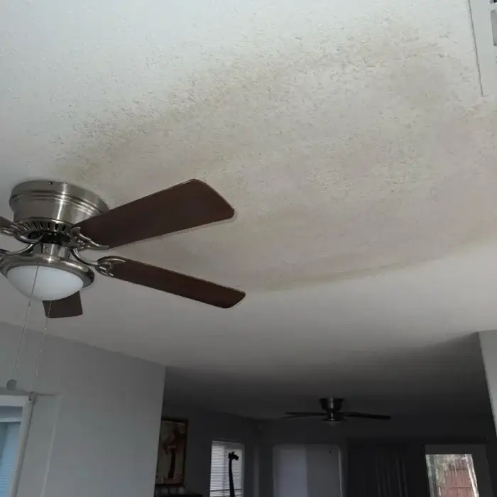 Water-stained ceiling before repair